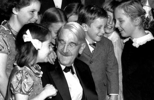 John Dewey surrounded by children on his 90th birthday