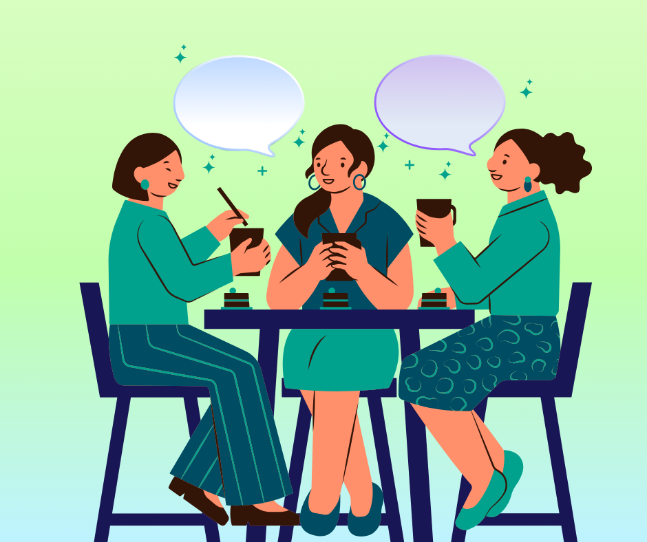 three women sitting at a table smiling and talking